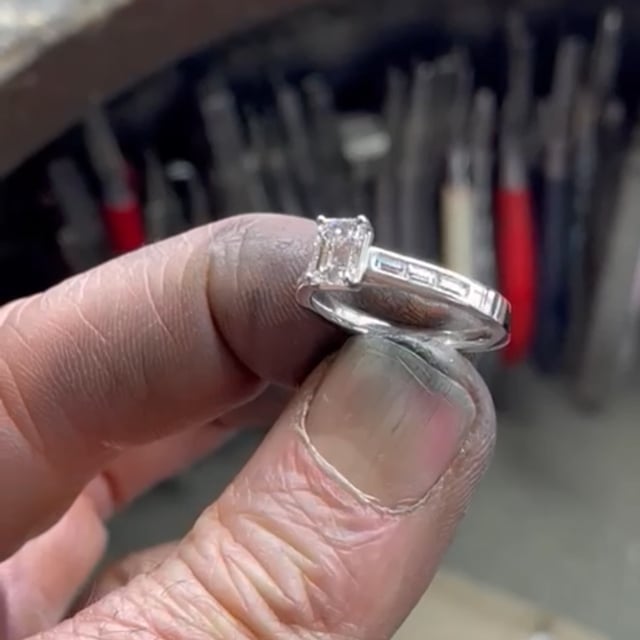 Emerald cut diamond ring with baguette cut set shoulders