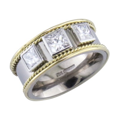 Platinum and gold heavy ring with three rub over set princess cut diamonds and 18 ct yellow gold twisted wire