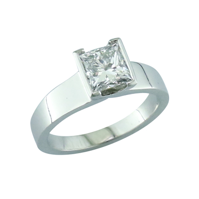 Princess cut diamond solitaire ring with wide platinum shoulders