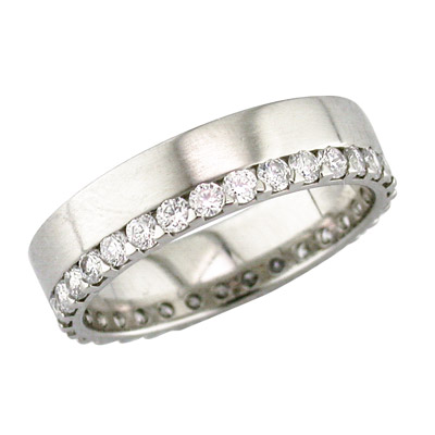 Platinum band with claw set diamonds