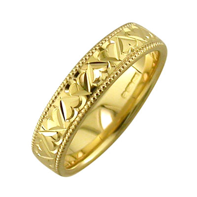 Gold diamond cut heart pattern ring