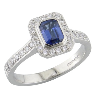 Emerald cut sapphire and Diamond halo cluster ring