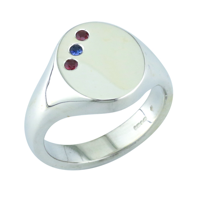 Platinum signet ring with a flush set sapphire and two rubies
