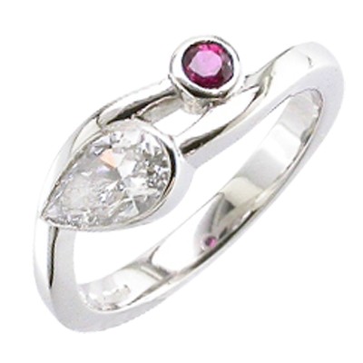 Pear shaped diamond and ruby two stone platinum ring