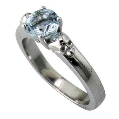 Aquamarine and skull detailed shoulder platinum ring