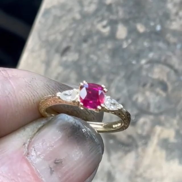Ruby and pear shaped diamond ring with antique style carving