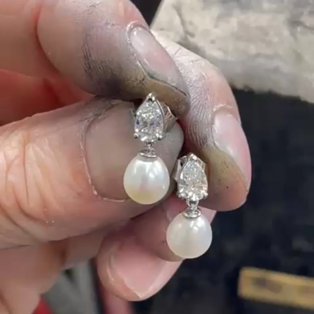 Pear shaped diamond and pearl  platnium earrings