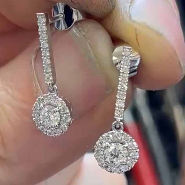 Platinum and diamond cluster style earrings