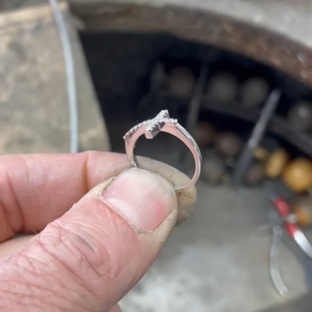 Platinum and diamond cross style ring