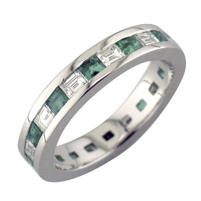 Emerald and diamond channel set platinum ring