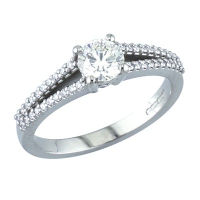 Platinum and diamond ring with split shoulders.