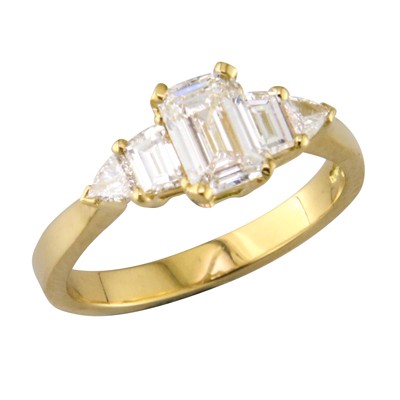 Diamond five stone, ring with three emerald cut shaped diamonds with trillion cut  diamonds on the end.