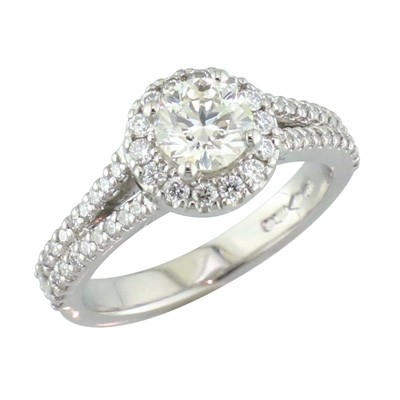 Circular shaped platinum and diamond cluster ring with split shoulders