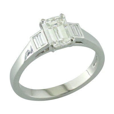Emerald cut diamond ring with two baguette cut diamond set in each shoulder