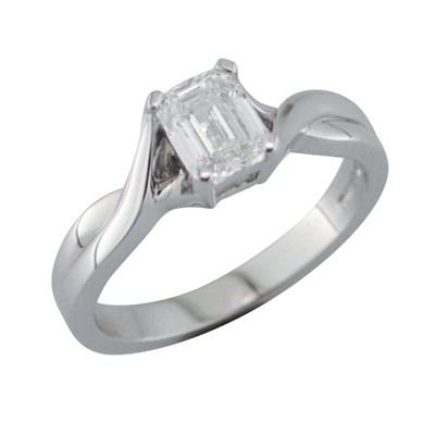 Emerald cut diamond single stone ring with fancy shoulders