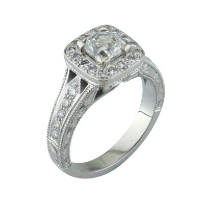 Cushion cut platinum halo cluster ring