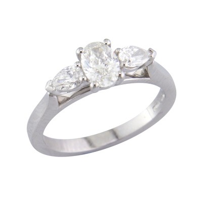 Oval and pear shaped diamond three stone platinum ring