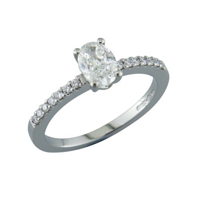 Oval shaped diamond solitaire with diamond set shoulders