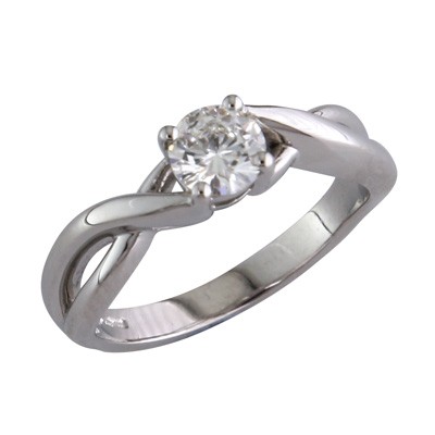 Platinum and diamond solitaire ring with twisted shoulders.