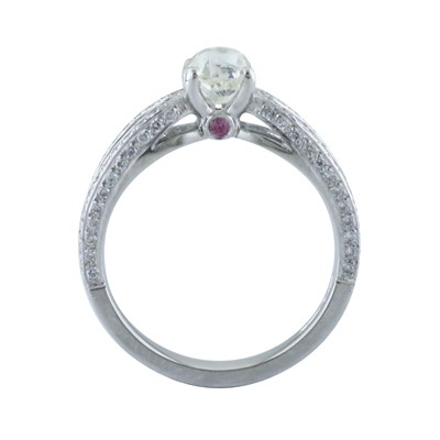 Platinum ring with hand carved side walls and ruby set setting