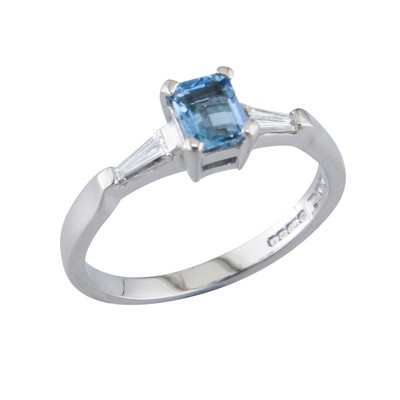 Aquamarine and tapered baguette cut diamond three stone ring