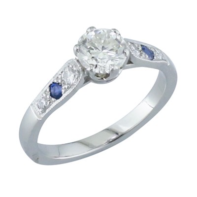 Platinum six claw solitaire ring with pave set shoulder
