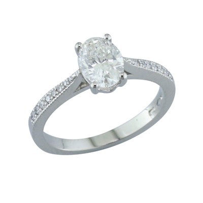 Oval shaped diamond solitaire with diamond set shoulders