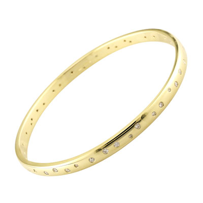 Gold bangle with flush set diamonds.