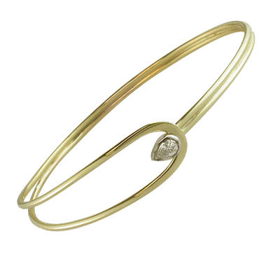 Gold bangle with pear shaped diamond