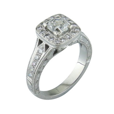 Platinum and diamond halo cluster ring with hand carving