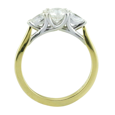 Round and pear shaped diamond three stone ring