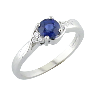 Sapphire and diamond platinum ring with trefoil diamond set shoulders