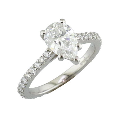 Pear shaped diamond solitaire with diamond claws set shoulders