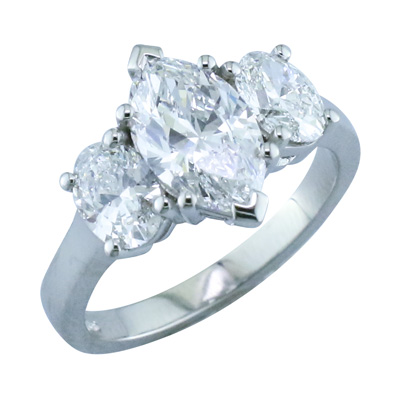 Marquise diamond and oval shaped diamond  three stone ring