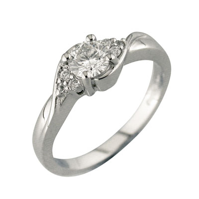 Platinum solitaire diamond  ring with trefoil set shoulders