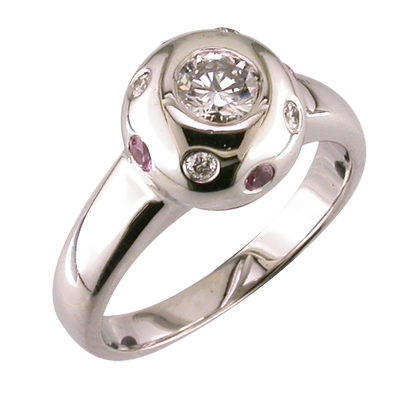 Heavy platinum ball style ring set with pink sapphires and diamonds