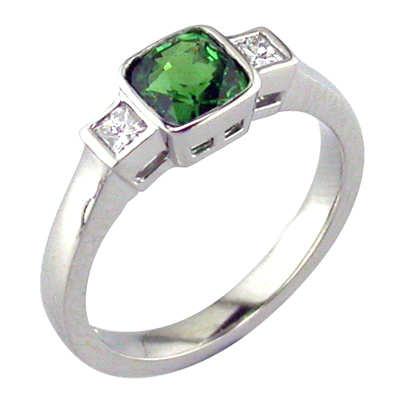 Green tourmaline three stone ring with princess cut diamonds