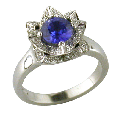 Platinum, sapphire and diamond flower style ring