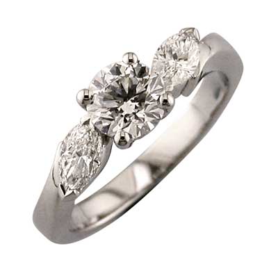 Diamond and marquise cut diamond three stone ring