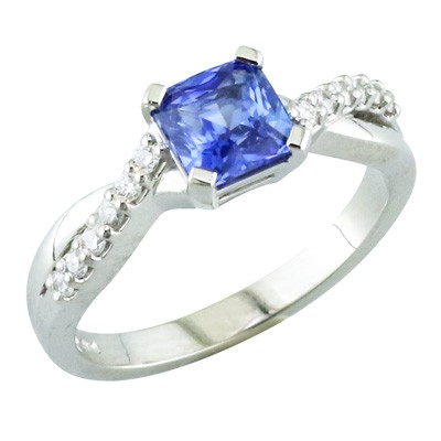 Platinum and sapphire ring with diamond set twisted shoulders