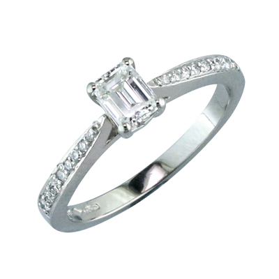 Emerald cut diamond single stone ring with pave set shoulders