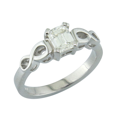 Emerald cut diamond ring with infinity style shoulders