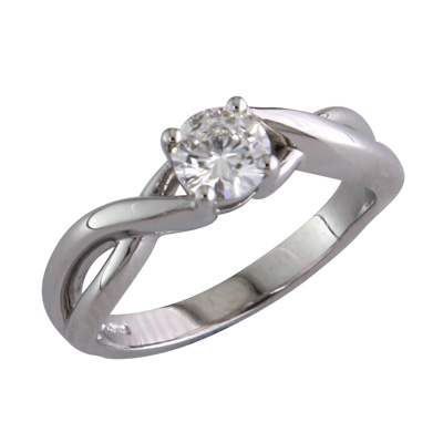 Single stone diamond ring with fancy twist style shoulders