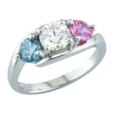 Three stone twist style ring with a pink sapphire a diamond and blue Zircon