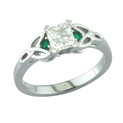 Emerald cut diamond singe stone ring with emerald and Celtic style shoulders