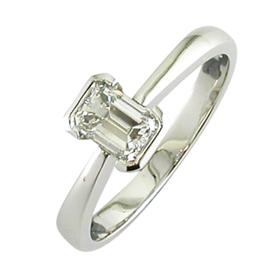 Bezel set emerald cut diamond ring