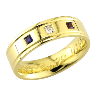 Gent’s yellow gold band with a sapphire, diamond and a ruby flush set across the top