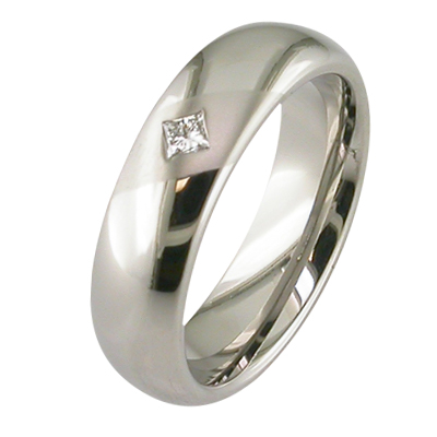Gent’s platinum wedding ring with a flush set diamond