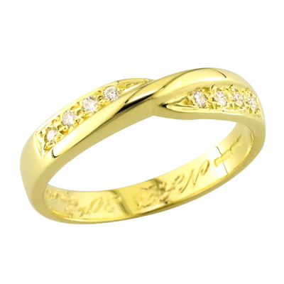 Gold diamond set twist ring