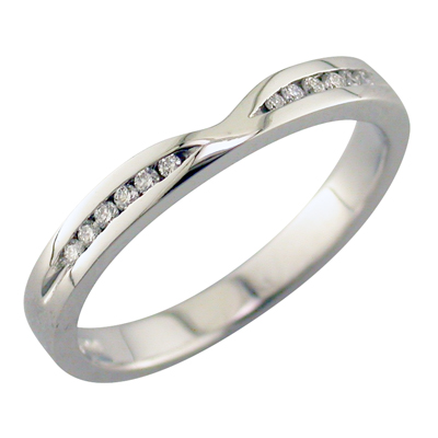 Platinum band with a cut out and channel set diamonds